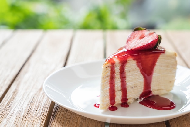 vanilla crape cake with strawberry sauce Free Photo