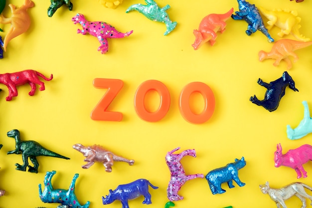 Various animal toy figures background with the word zoo Free Photo