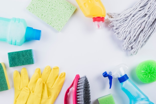 Various cleaning equipments on grey background | Free Photo