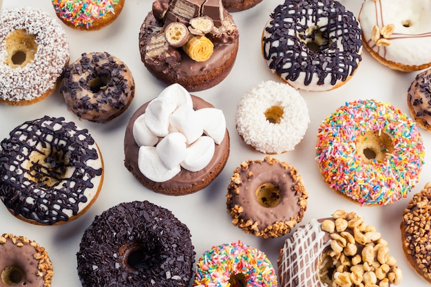 Premium Photo | Various flavours donuts