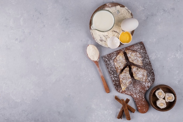 Free Photo | Various pastries and ingredients on the wooden platter