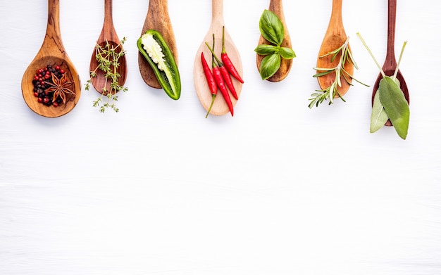 Premium Photo | Various of spices and herbs on wooden background.