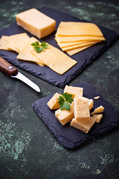 Premium Photo | Various type of sliced cheese