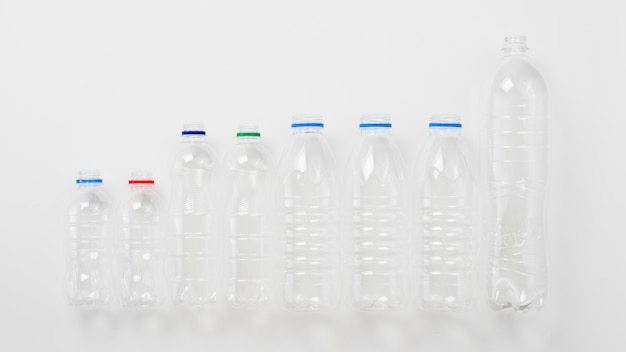 Various types of plastic bottles on grey background Free Photo