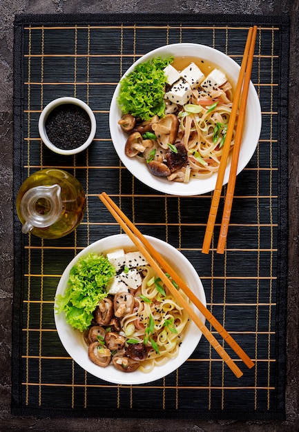 Premium Photo | Vegan noodle soup with tofu cheese, shiitake mushrooms ...