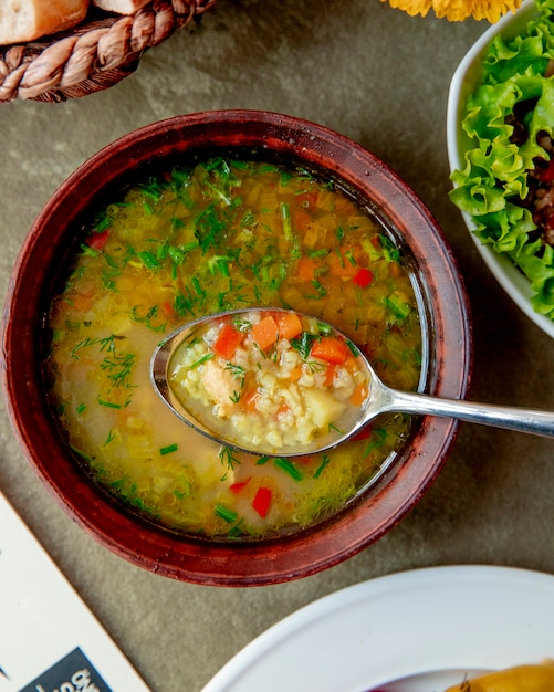 Free Photo | Vegetable soup served with herbs