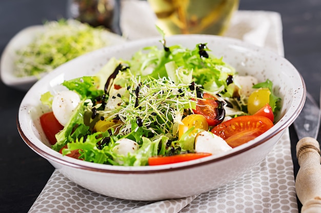 Free Photo | Vegetarian salad with cherry tomato, mozzarella and lettuce.