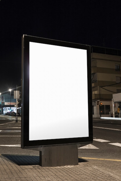 Free Photo | Vertical blank billboard on street at night