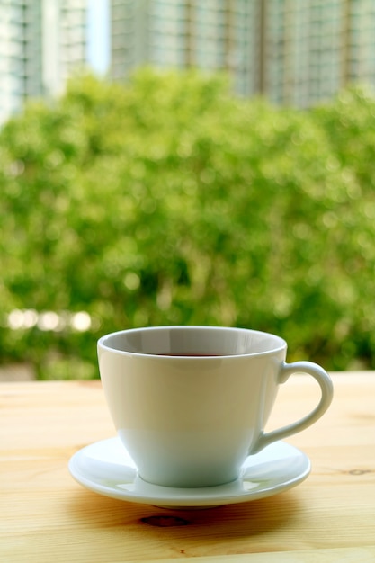 Premium Photo Vertical Image Of A Cup Of Hot Tea On The Window Side Wooden Table