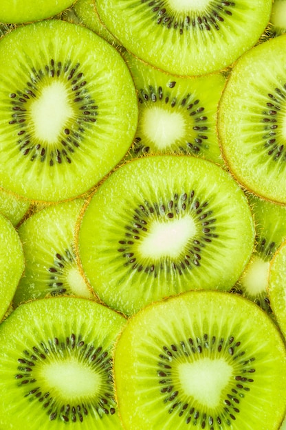 Premium Photo | Vertical image, flat lay of kiwi slices.