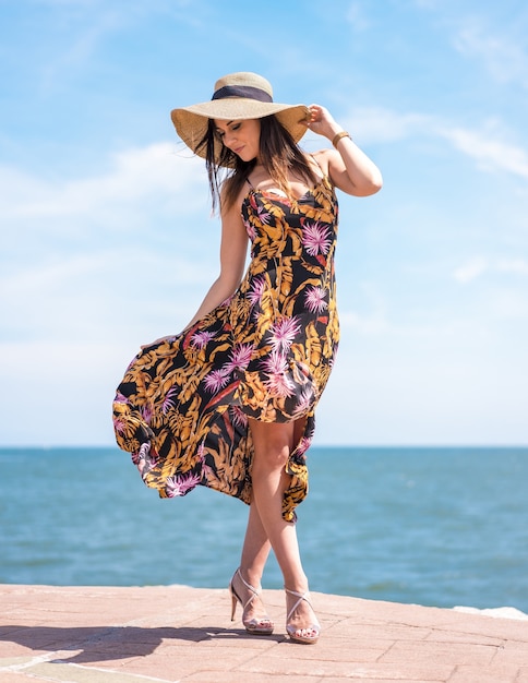 Premium Photo | Vertical shot of a beautiful female in a floral ...