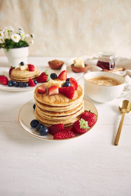 Free Photo | Vertical shot of pancakes with strawberries
