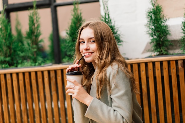 Premium Photo | Very beautiful young woman, sit in cafe and drink ...