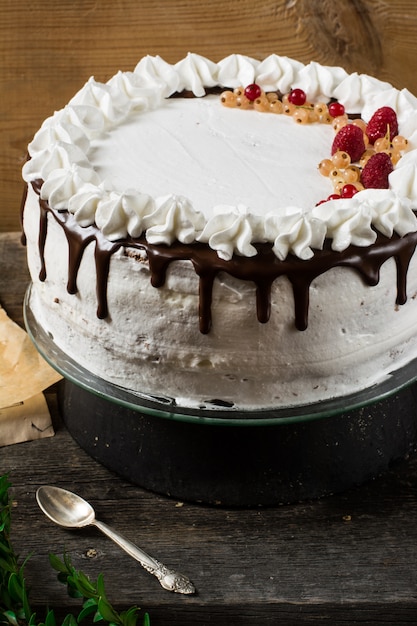 Victoria cake with raspberry, cranberries, mint, red currant. dessert. black forest cake. Premium Photo