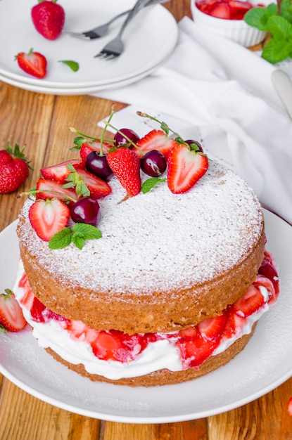 Premium Photo | Victoria sponge cake with whipped cream and strawberry