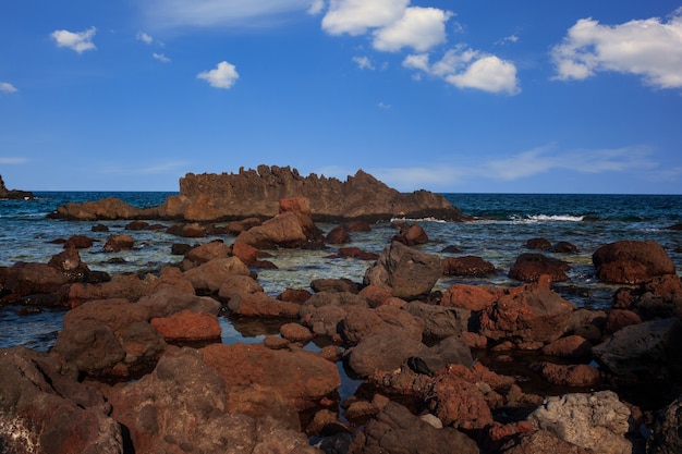 Premium Photo | View of the lava beach of linosa called faraglioni ...