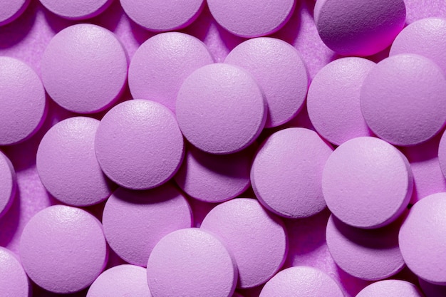 Free Photo | Above view pills on purple background