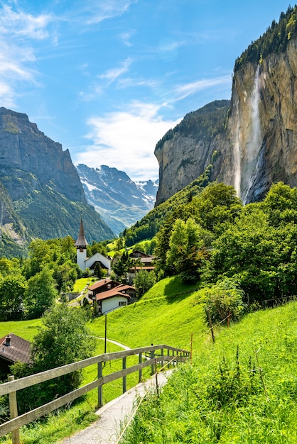 Premium Photo | The village church and the staubbach falls in ...