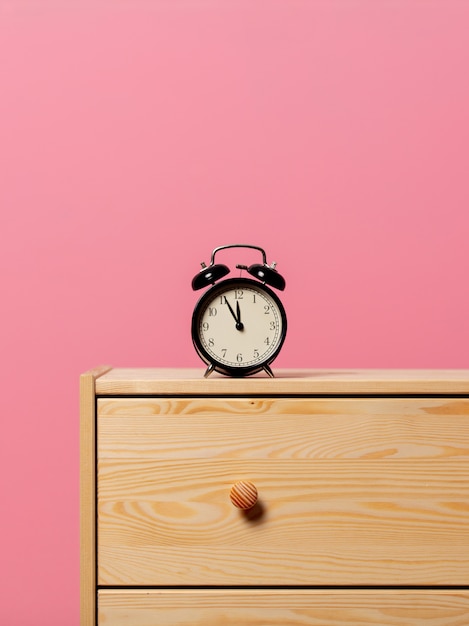 Vintage Alarm Clock On Bedside Table Premium Photo