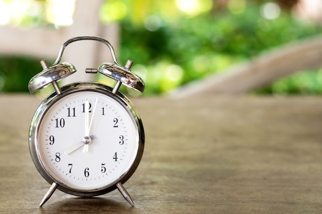 Premium Photo | Vintage Alarm Clock On Natural Wooden Table With ...