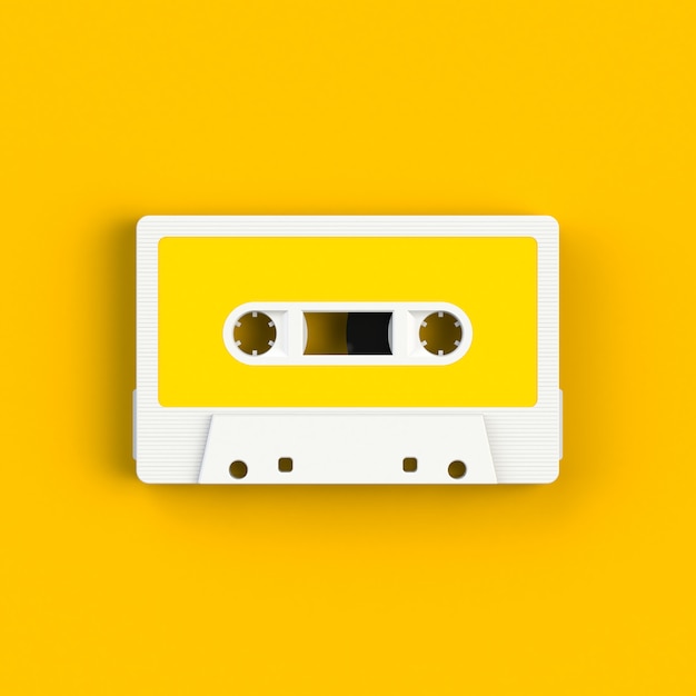 Download Vintage audio tape cassette on yellow | Premium Photo