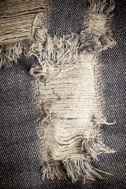 Premium Photo | Vitage torn denim jeans texture.
