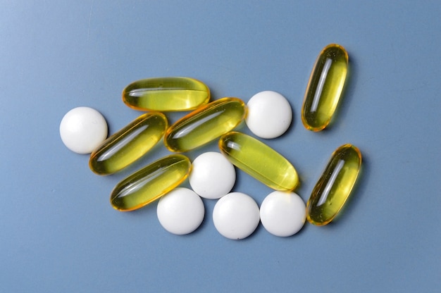 Premium Photo | Vitamins in capsules and tablets. top view