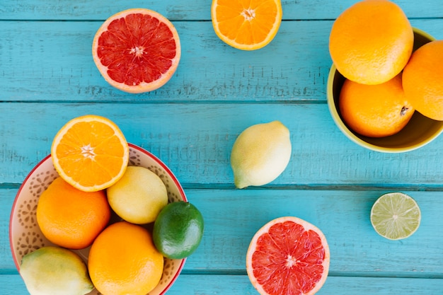 Free Photo Vivid Fresh Citrus Fruits On Wooden Surface Free Photo Vivid Fresh Citrus Fruits On Wooden Surface
