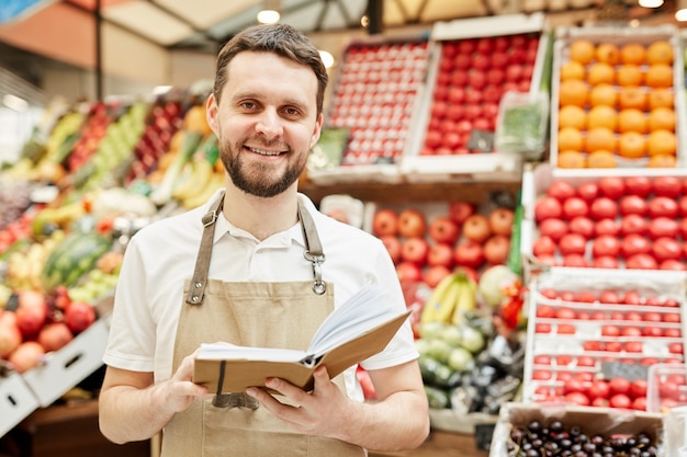 Premium Photo | Waist up portrait of bearded man wearing apron and ...