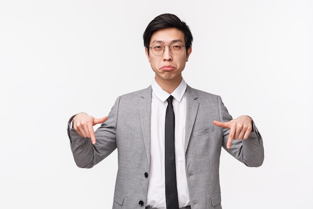 Premium Photo | Waist-up portrait of skeptical, suspicious asian man in ...