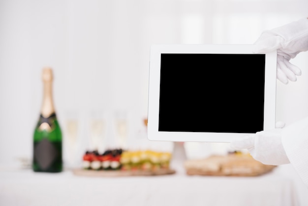 Download Waiter holding tablet with mockup Photo | Free Download