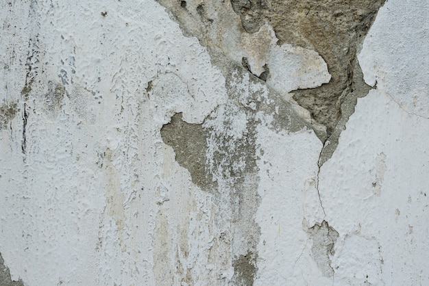 Wall fragment with scratches and cracks Premium Photo