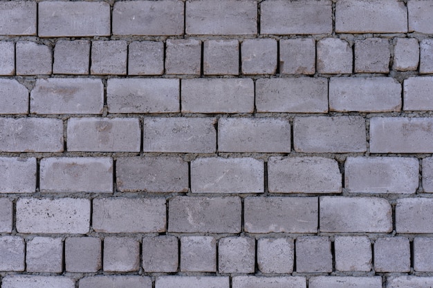 背景として テクスチャのコンクリートブロックの壁 プレミアム写真