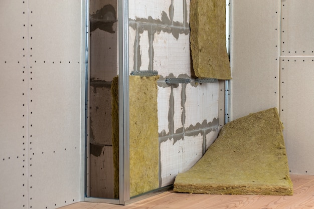 Premium Photo Wall Of A Room Under Renovation With Mineral Rock Wool Insulation And Metal Frame Prepared For Drywall Plates