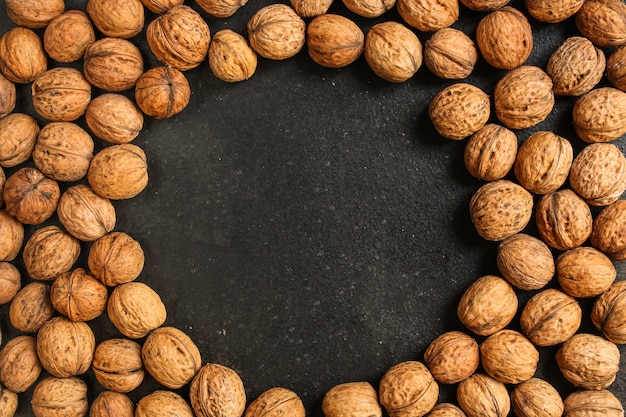 Walnuts, tasty and healthy (kernels, whole nuts) menu . food background. copyspace. top view Premium Photo
