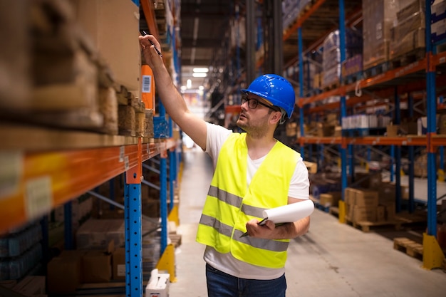 Free Photo | Warehouse worker checking inventory in large distribution ...