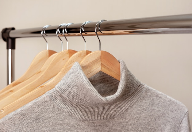 Premium Photo | Warm clothes on a hanger