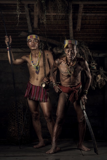 Premium Photo Warrior of mentawai  the indigenous 