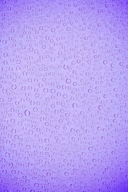 Premium Photo | Water bubble on mauve glass.