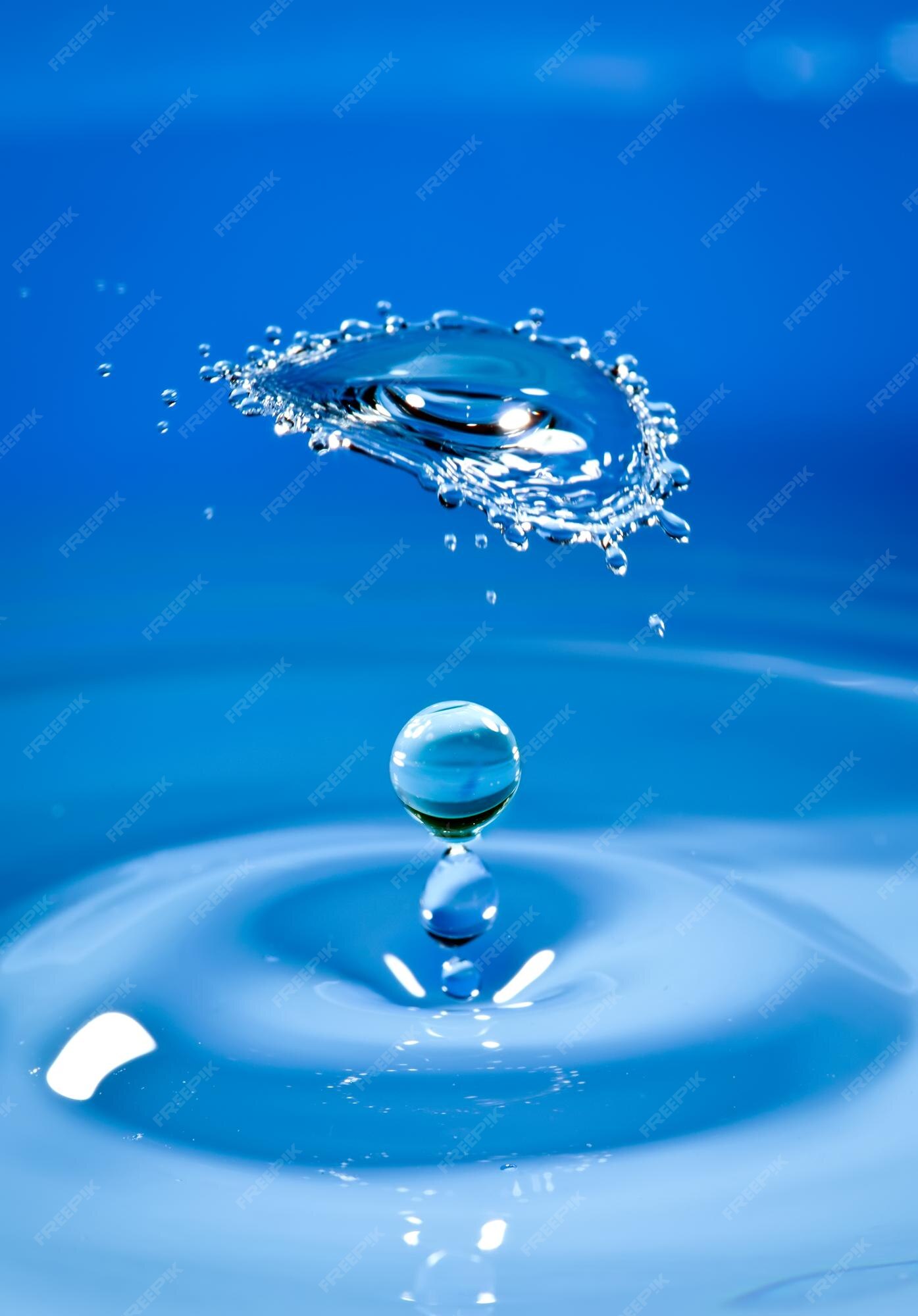 premium-photo-water-drop-falls-downwards-breaking-about-a-drop