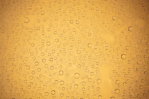 Premium Photo | Water drops on brown background.