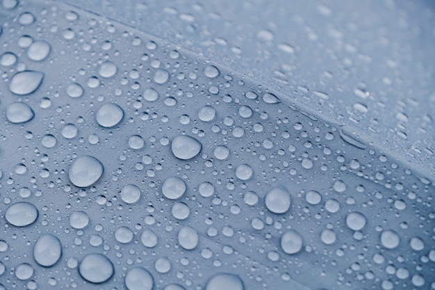 水滴テクスチャ背景 傘のクローズアップ雨滴 プレミアム写真