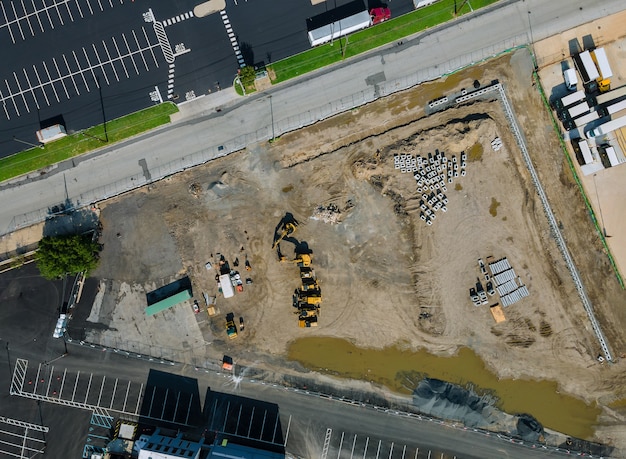 Premium Photo | Water and sewage pipes stacked in ground during ...