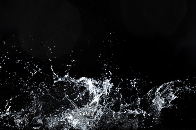 Water splash on black background, fresh feeling | Premium Photo