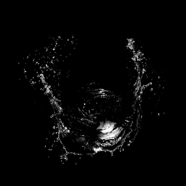 Premium Photo | Water splashing isolated over a black background.