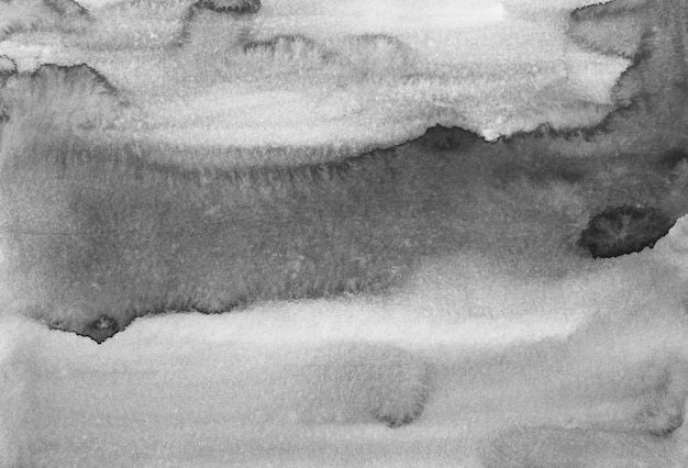 水彩の黒と白の背景のテクスチャです 紙のオーバーレイにモノクロの汚れ 抽象的な水彩画 プレミアム写真