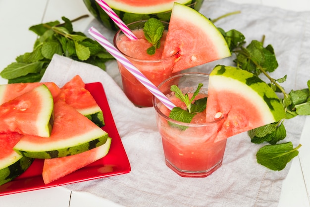 Watermelon smoothies and watermelon slices on plate Free Photo