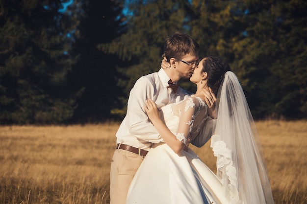 Premium Photo | Wedding couple. bride and groom in forest, summer time.