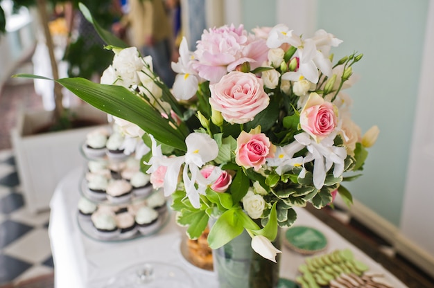 Wedding Dinner In The Restaurant Tables Decorated With Vases Of