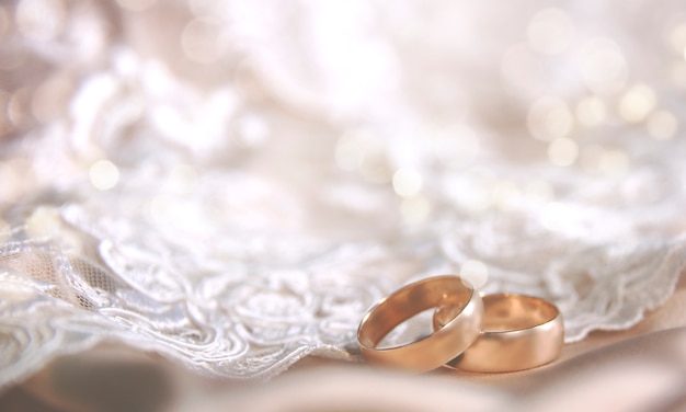 Premium Photo | Wedding ring on the vintage lace